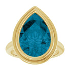 Handmade statement ring with 15x10mm blue topaz in solid yellow gold
