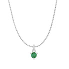 Tiny emerald solitaire necklace in 14K white gold