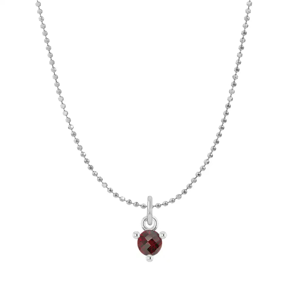 Tiny garnet solitaire necklace in 14K white gold