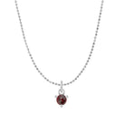 Tiny garnet solitaire necklace in 14K white gold