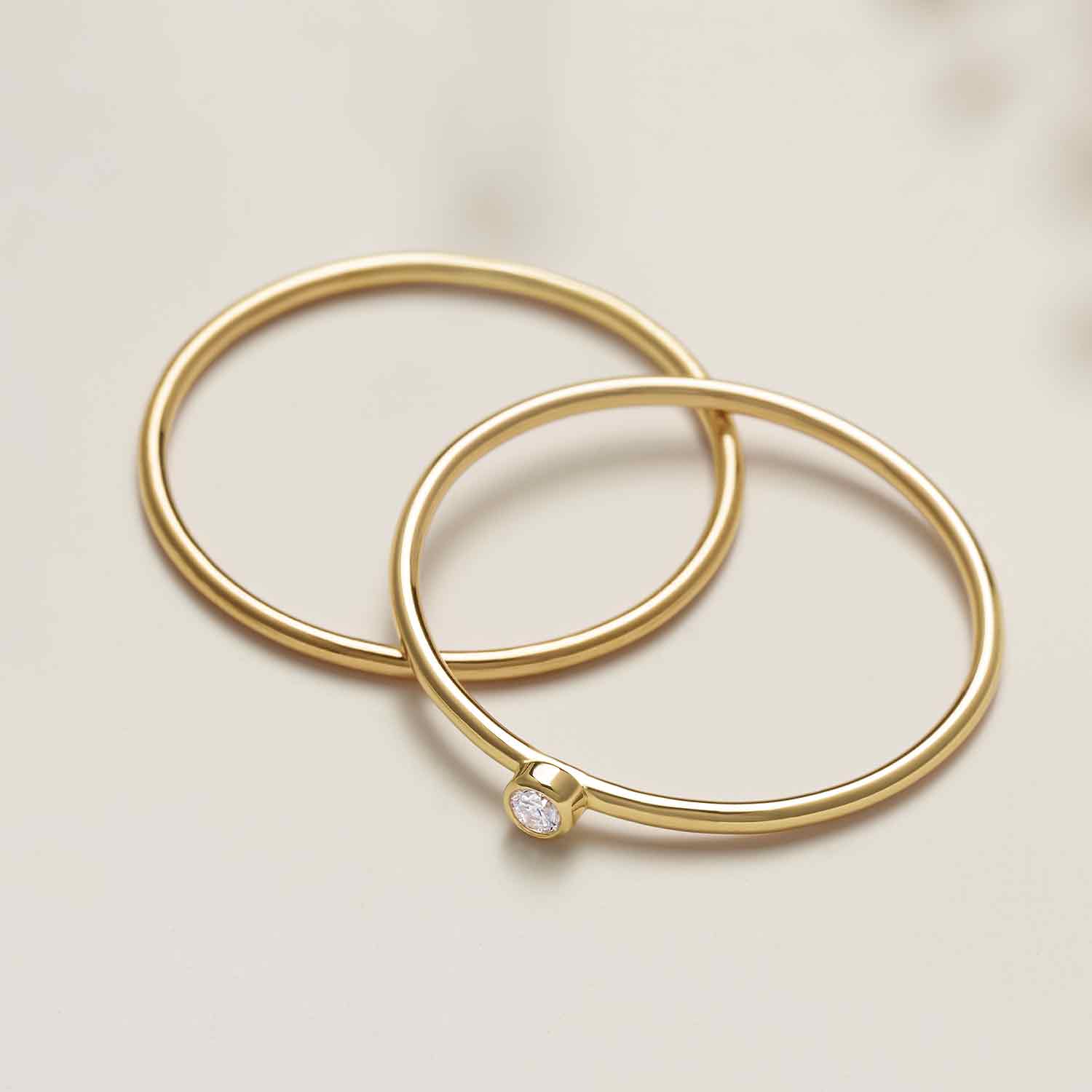 Tiny diamond stackable ring in 14K gold, front view