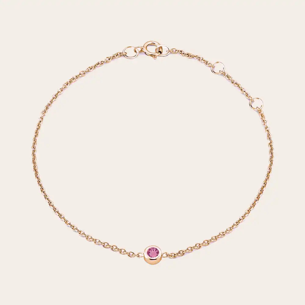 Bezel-set tourmaline bracelet in 14K rose gold, close-up of pink stone in bezel rose gold variant--14K-rose-gold variant--Tourmaline