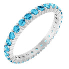 Aquamarine eternity ring in 10K white gold, handcrafted using recycled metal.