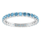 Ethical Swiss Blue Topaz ring in solid 10K white gold with a full circle of 2mm gemstones.