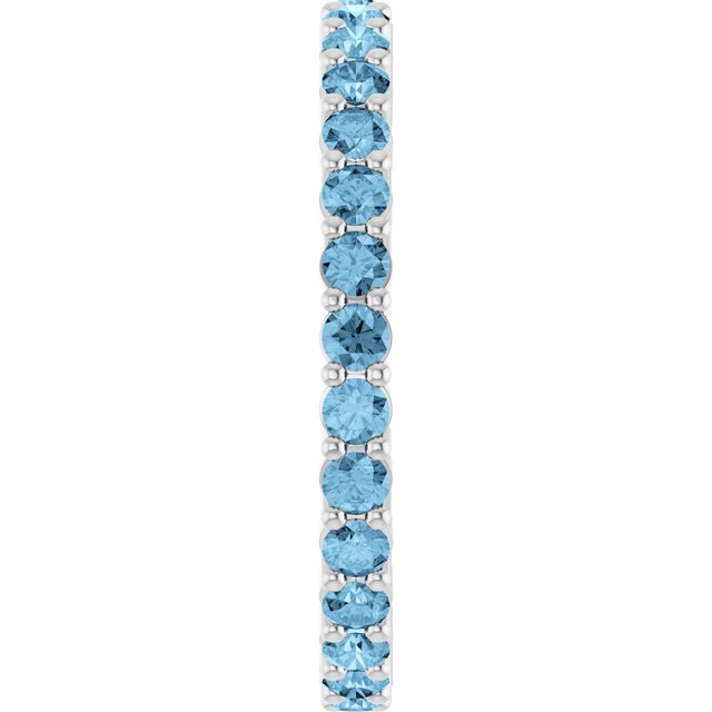 Minimalist white gold stacking ring set with sustainably sourced Swiss Blue Topaz gems.