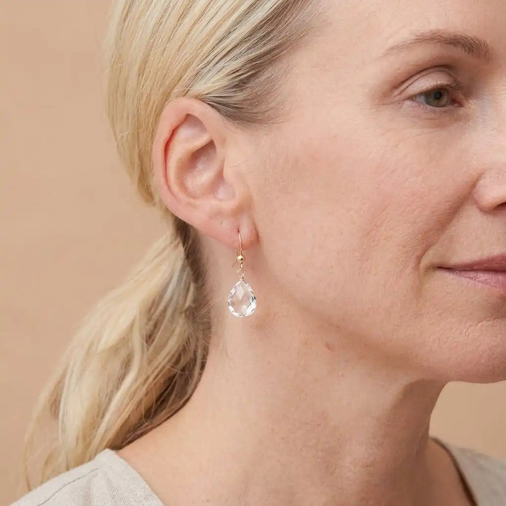 Drop earring in gold-fill shown on model