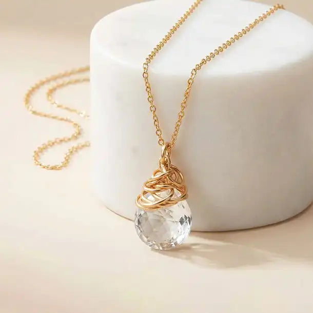 Natural white topaz pendant necklace in gold-fill editorial shot  variant--Gold-fill, variant--Rose-gold-fill, variant--Sterling-silver, variant--Oxidized-sterling-silver variant--White-Topaz