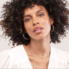 Model shot of classic wide tube hoop earrings