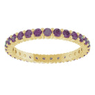 Minimalist yellow gold stacking ring set with sustainably sourced Alexandrite gems.