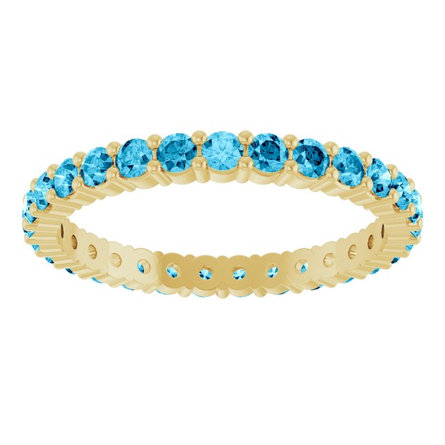 Minimalist yellow gold stacking ring set with sustainably sourced Aquamarine gems.