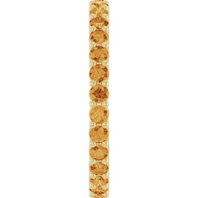 Minimalist yellow gold stacking ring set with sustainably sourced Citrine gems.