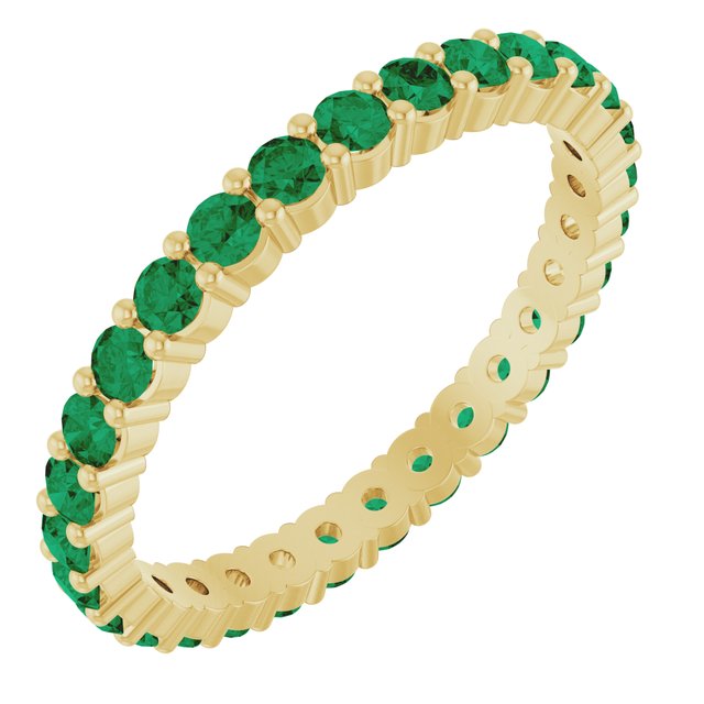 Emerald eternity ring in 10K yellow gold, handcrafted using recycled metal.