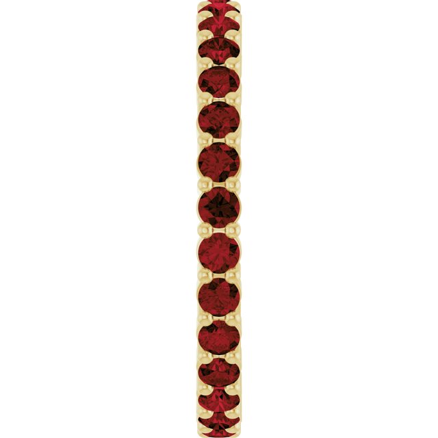 Minimalist yellow gold stacking ring set with sustainably sourced Garnet gems.