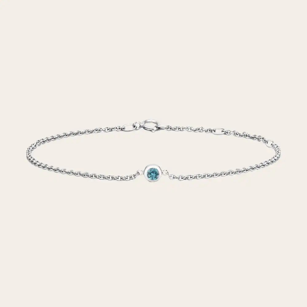 Bezel-set birthstone bracelets displayed together. silver variant--Sterling-silver