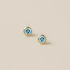 Zircon stud earrings in 14K gold, 4mm blue zircon, product shot