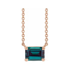 Minimalist 14K rose gold Alexandrite birthstone necklace featuring a 5x3mm emerald-cut pendant.