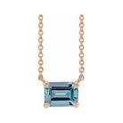 Minimalist 14K rose gold Aquamarine birthstone necklace featuring a 5x3mm emerald-cut pendant.