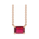 Minimalist 14K rose gold Ruby birthstone necklace featuring a 5x3mm emerald-cut pendant.