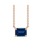 Minimalist 14K rose gold Sapphire birthstone necklace featuring a 5x3mm emerald-cut pendant.