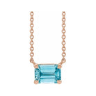 Minimalist 14K rose gold Zircon birthstone necklace featuring a 5x3mm emerald-cut pendant.
