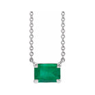 Minimalist 14K white gold Emerald birthstone necklace featuring a 5x3mm emerald-cut pendant.