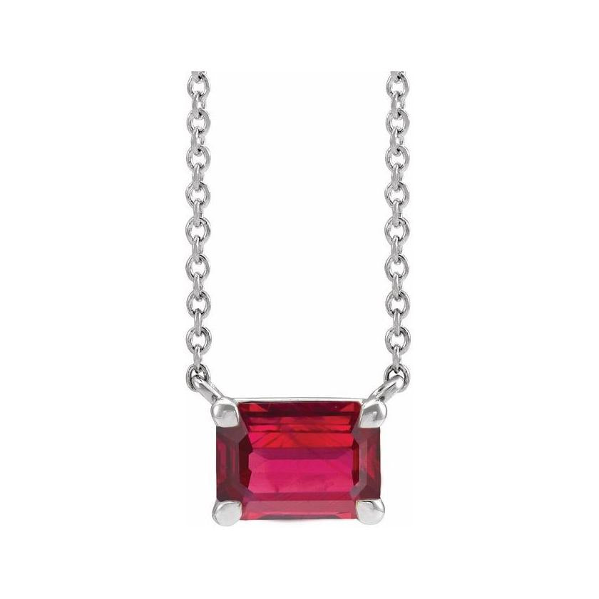 Minimalist 14K white gold Ruby birthstone necklace featuring a 5x3mm emerald-cut pendant. variant--Ruby variant--14K-white-gold
