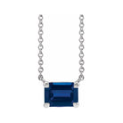Minimalist 14K white gold Sapphire birthstone necklace featuring a 5x3mm emerald-cut pendant.