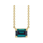 Minimalist 14K yellow gold Alexandrite birthstone necklace featuring a 5x3mm emerald-cut pendant.