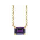 Minimalist 14K yellow gold Amethyst birthstone necklace featuring a 5x3mm emerald-cut pendant.