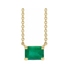 Minimalist 14K yellow gold Emerald birthstone necklace featuring a 5x3mm emerald-cut pendant.