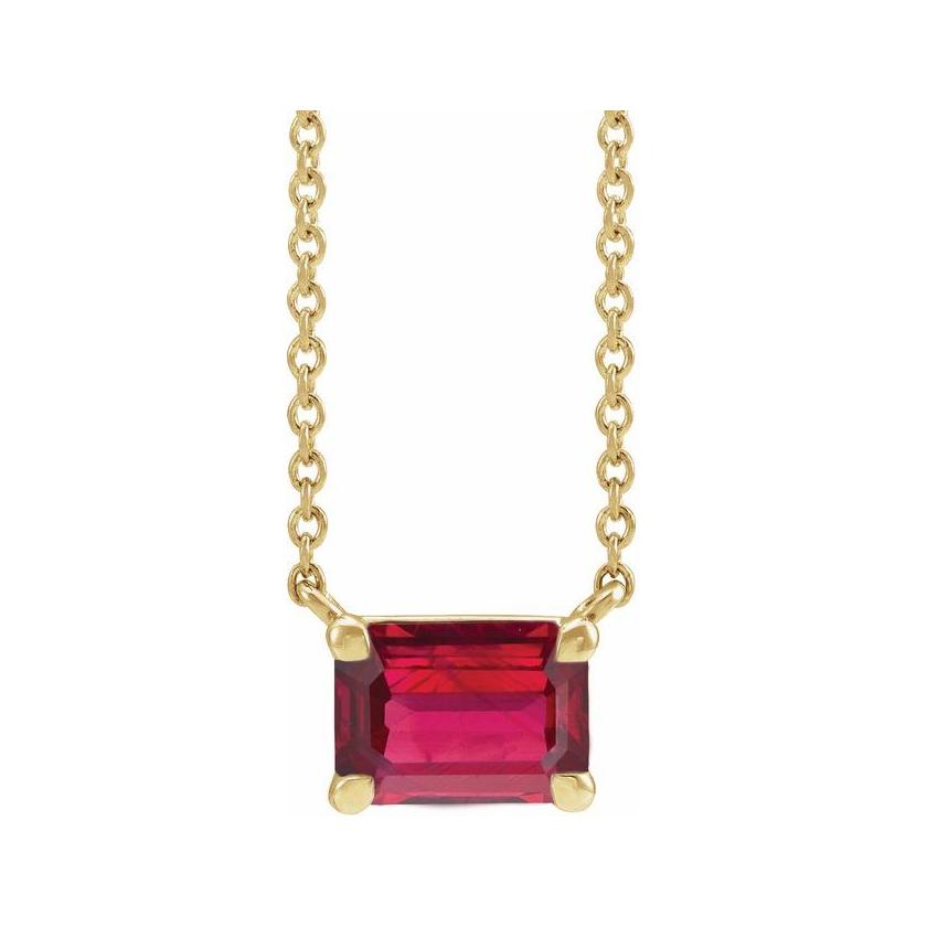 Minimalist 14K yellow gold Ruby birthstone necklace featuring a 5x3mm emerald-cut pendant. variant--Ruby variant--14K-yellow-gold