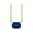Minimalist 14K yellow gold Sapphire birthstone necklace featuring a 5x3mm emerald-cut pendant.