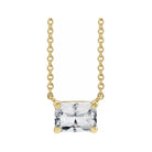 Minimalist 14K yellow gold White Sapphire birthstone necklace featuring a 5x3mm emerald-cut pendant.