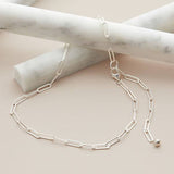 Sterling silver paperclip chain necklace, artfully handmade in the USA, shown styled as a modern layering piece. variant--Sterling-silver