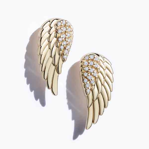 Diamond angel wing stud earrings close up in 14K yellow gold