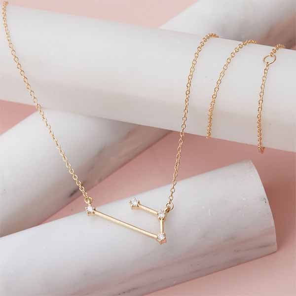 Aries zodiac necklace with diamond star map design in gold