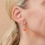 Custom gemstone drop earring in gold-fill, styled on model showing 1.5-inch drop length