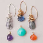 Custom Dangle earrings with various gemstones shown for editorial purposes.