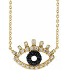 Diamond evil eye necklace in 14K gold with pavé black and white diamonds.