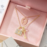 Pavé diamond love lock charm in yellow gold