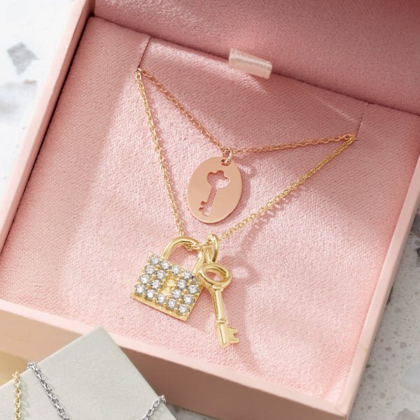 Pavé diamond love lock charm in yellow gold