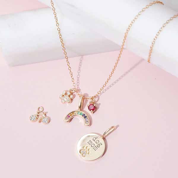 Yellow gold paw print diamond pendant