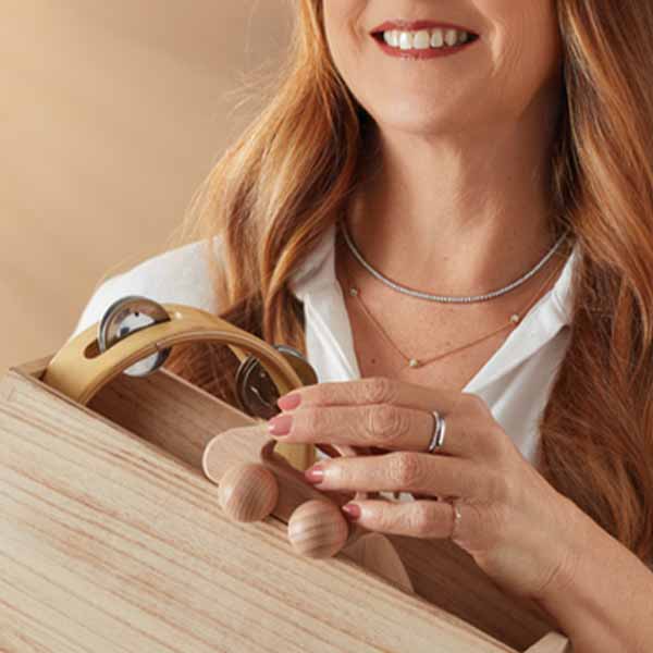 Model wearing 14k yellow gold diamond station necklace — minimalist, sparkling jewelry perfect for everyday or special occasions.