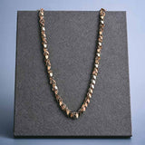 Gold-fill shaker chain at 20-inch length, layered styling on model