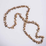Elysian adjustable shaker chain styled with complementary gold necklaces