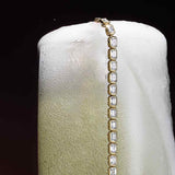 Emerald-cut lab-grown diamonds set in 14K gold tennis bracelet