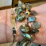 Engravable ID Bracelet layered with other bracelets on wrist