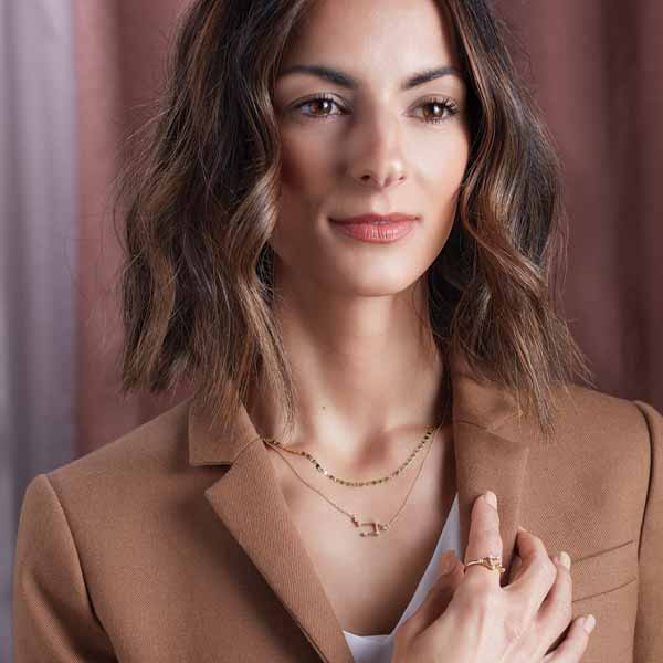 Astrological constellation in diamonds on 14K gold chain styled on model