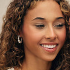 Sterling silver pearl hoop earrings styled with minimal jewelry