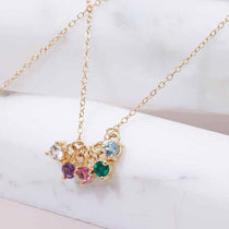 Charm clustered with other birthstones on a chain, family story variant--14K-rose-gold variant--14K-white-gold variant--14K-yellow-gold variant--Zircon
